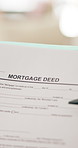 Person, hands and document with mortgage deed for legal contract, policy agreement or deal. Paper, reading or binding application with pen for property investment, financial loan or asset management