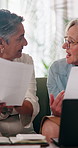 Financial planning, paperwork and lesbian couple with laptop in house, talking and checking savings. Lgbtq, relationship and mature women with tech for budget review, discussion and documents in home