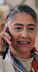 Smile, phone call and senior woman in house for communication, chat and connection. Happy person, retirement and listening to gossip story with talking, mobile conversation and contact in home