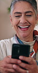 Mature, woman and laugh in home with phone, funny text message response and social media notification. Happy, person and typing in lounge with tech, humor and online meme from digital communication.