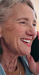 Mature, woman and smile in house with phone call, conversation and gossip update on weekend break. Happy, female person relax and tech in living room with contact, discussion and listen to feedback.