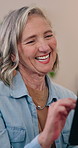Mature, woman and laugh in home with tablet, funny social media notification and reading digital news. Happy, person and scroll in lounge with tech, humor and online meme from browsing blog website.