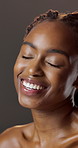 Beauty, laughing and wellness with black woman in studio for hydration results or satisfaction. Eyes closed, glow and shine with funny person on dark background for collagen, skincare or vitamin c