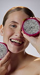 Dragon fruit, face and smile of woman in studio for cosmetics, gut health or skincare. Aesthetic, beauty and vitamin c with happy person on white background for dietary fibre, nutrition or wellness