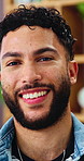 Wellness, face and man in living room with smile, positive attitude and unwind with weekend break. Wellbeing, portrait and happy person in house with confidence, good mood and satisfaction on day off