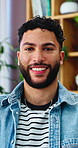 Wellness, face and man in home with smile, positive attitude and unwind with weekend break. Wellbeing, portrait and happy person in living room with confidence, good mood and satisfaction on day off.