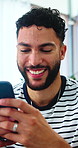 Phone, happy and man on sofa in home with texting, social media or chatting on mobile app. Smile, technology and person with cellphone for networking, contact or email with relax in living room.