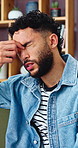 Man, stress and thinking with headache in home, thoughts and frustrated by student loan or pressure. Reflection, migraine and person with anxiety for college debt, contemplating and regret in house