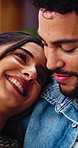 Happy, love and couple in home with connection, bonding or care in marriage together on weekend. Smile, affection and woman embracing man in living room for commitment, loyalty and trust in apartment