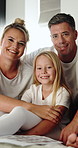 Happy, face and parents with child in home, connection and bonding with daughter on weekend or love. Family, portrait and relax with girl, break and people with smile for kid and childcare in house