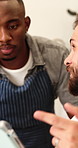 Waiter, men and talking with tablet in cafe for barista training, order entry and POS system. Small business, team or happy manager with restaurant app for online stock, workflow and menu navigation