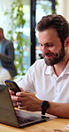 Man, phone and freelancer with smile in coffee shop, insurance email or communication with laptop. Mobile, reading and happy person in cafe for remote work, policy message or typing text on internet