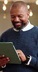 Mature, businessman and typing in office with tablet, good news and smile for email notification. Bokeh, black person and tech in workplace with internet, reading and happy for company communication.