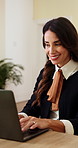 Happy, woman and typing in office with laptop, good news and submission of public relations statement. Mature person, smile and PR agent in business with computer, internet and upload press release.