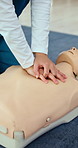 CPR, hands and nurse practice with mannequin for healthcare, first aid training or emergency rescue. Woman, life saving and person with dummy for learning, medical simulation and nursing school