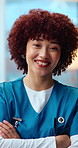 Face, woman and nurse in clinic with arms crossed, assistance and medical pride for wellness. Portrait, female person or employee in hospital with happiness, positive attitude and healthcare services