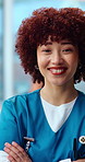 Face, woman and nurse in hospital with arms crossed, assistance and medical staff for wellness. Portrait, female person and employee in workplace with smile, positive attitude and healthcare services
