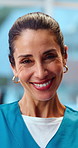 Happy, woman and nurse in hospital with face, assistance and medical advisory for wellness. Portrait, mature person and laughing in workplace with employee, positive attitude and healthcare services