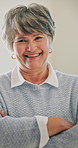 Laugh, face or old woman in home with arms crossed, positive attitude or humor on weekend break. Wellness, smile or elderly person in house with funny joke, happy moment or satisfaction in retirement
