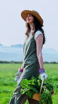 Farm, walking and happy woman with basket of vegetables, fresh produce or harvest for sustainability. Agriculture, farmer and person with crops for growth, food production and thinking in countryside