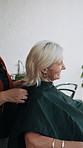 Salon, hairdresser and cape for client, laughing and preparing for hair removal and haircut routine. Small business, entrepreneur and cover for woman, happy and getting ready for trim with stylist