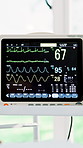 Monitor, hospital or screen with vital signs for patient treatment, healthcare exam or tests. Person, computer display or ECG diagram with numbers on machine for hearth rhythm, recovery or cardiology