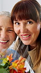 Happy, face and senior patient with adult daughter for family visit, flowers or gift in hospital. Portrait, elderly mom and woman with smile or bouquet in clinic for health or wellness in clinic