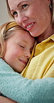 Home, mother and hug kid for love, bonding together and smile with connection on weekend. Happy family, parent and embrace girl with care in lounge for support, security and trust with daughter