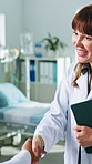 Smile, woman and doctor in hospital with handshake, welcome or introduction for medical support. Happy, people and shaking hands in clinic for greeting, partnership and agreement for healthcare offer