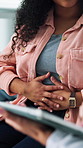 Doctor, patient and hands with discussion for stomach ache, help and tablet for endometriosis survey. Healthcare worker, person and abdomen pain in clinic with tech, advice and ovarian cyst symptoms.