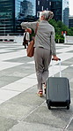 Late, watch or businesswoman in town with running, meeting change or urgent rush for seminar. Back, sprint or mature employee outdoor with suitcase, time pressure or hurry for corporate conference.