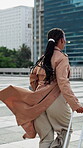 Late, suitcase or businesswoman in city with running, meeting change or urgent rush for seminar. Back, sprinting or employee in town with luggage, time pressure or hurry for corporate conference.