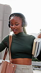 Student, dancing and black woman with headphones in city for audio streaming, vibe or music. Happy, female person or academic learner listening with lens flare for sound app or songs in an urban town
