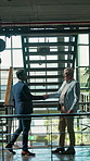 Meeting, handshake and men in office for greeting, introduction or recruiting in lobby. Business people, welcome and shaking hands with interview for hiring, opportunity or onboarding for candidate