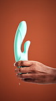 Sensual, liquid and hands of person in studio for pleasure, personal intimacy or tutorial for self love. Space, tool and woman with lubrication for passion, sex education and health on red background