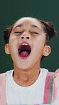 Tired, yawning and child in studio with fatigue, sleepy and boredom with low energy on background. Adorable girl, kid and exhausted on backdrop with laziness, sleepless and insomnia with open mouth