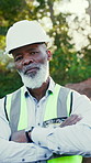 Face, contractor and man with confidence at construction site, building development or about us. African person, arms crossed and mature engineer outdoor with pride, portrait and safety helmet