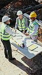 Architect, handshake and people outdoor at construction site with blueprint, building and excavation. Above, men and woman shaking hands for teamwork, collaboration and civil engineering success