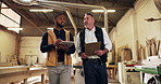 Carpentry, men and inspection with tablet in workshop for quality assurance, compliance or flare. Carpenter, inspector or discussion with tech in warehouse for stock check, joinery safety or feedback