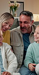 Happy, laugh and family on sofa in home with bonding, conversation and care on weekend. Relax, humor and children with mother and father in living room for connection, love and together in house