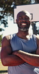 Face, black man and arms crossed on court for basketball, fitness and match practice with smile. Portrait, mature person and happy on turf with player, sports training and confidence for game contest