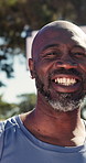 Face, black man and player on court for basketball, fitness and proud for match practice. Portrait, mature person and smile on turf with confidence, sports training and weekend hobby for game contest