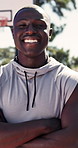 Face, black man and happy on court for basketball, fitness and proud for match practice. Portrait, male person and player on turf with arms crossed, sports training and weekend hobby for game contest