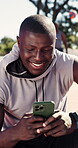 Basketball court, break and man with phone, laughing and communication with contact on social media. Texting, online and black person with mobile after sport competition, happy and funny chat on app