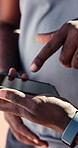 Outdoor, team and hands with phone, fitness and tracking performance on app after physical activity. Athlete, online and people with mobile on break, scroll and searching for workout tips on website