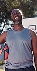 Face, black man and laugh with ball for basketball, fitness and confident for match practice. Portrait, mature person and happy on turf with player, sports training and weekend hobby for game contest