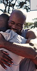 Happy, basketball and friends with handshake on court for game, practice together and training. Outdoor, sports and African men with hug for fitness, exercise and greeting for match, health and hobby