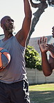 Outdoor, training and men with basketball, fitness or practice for skill development with instructor. Active, athlete and black person with personal trainer, exercise and technique for sport match