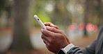 Phone, typing and hands of man outdoor for texting, chatting or social media with fitness advice. Technology, scrolling and person with cellphone for sports blog or article on mobile app for exercise