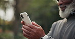 Cellphone, typing and hands of man outdoor for texting, chatting or social media with fitness advice. Technology, nature and mature person with phone for sports blog on mobile app for exercise.
